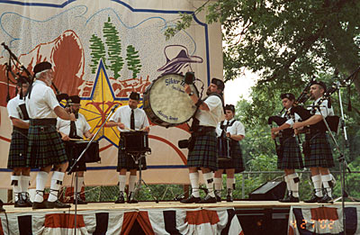 The Silver Thistle Pipes and Drums on stage.