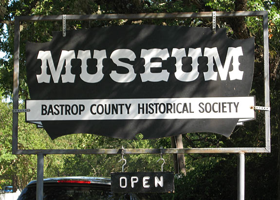 Welcome sign to the Bastrop County Historical Society Museum.