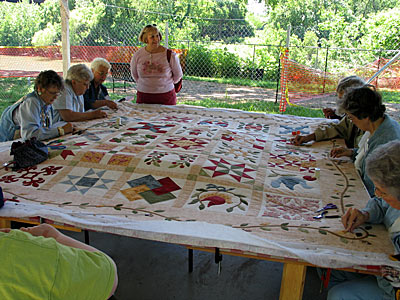 The Bastrop Senior Center Quilters at work on their new quilt design!