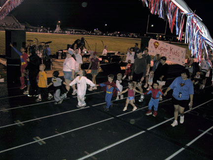 Superkids, one of 52 Relay Teams taking their lap around the track.