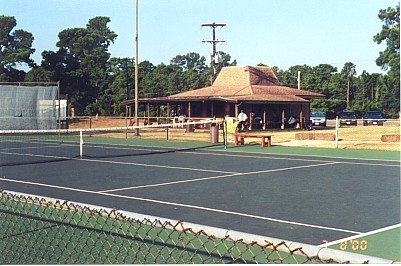 View of one of the nine tennis courts and the Pro Shop. 